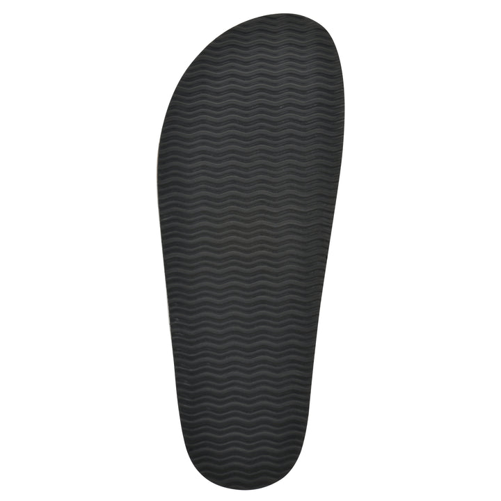 Sole view of a black leather backless clog with Mary Jane style center strap and a brown sole with black bottom