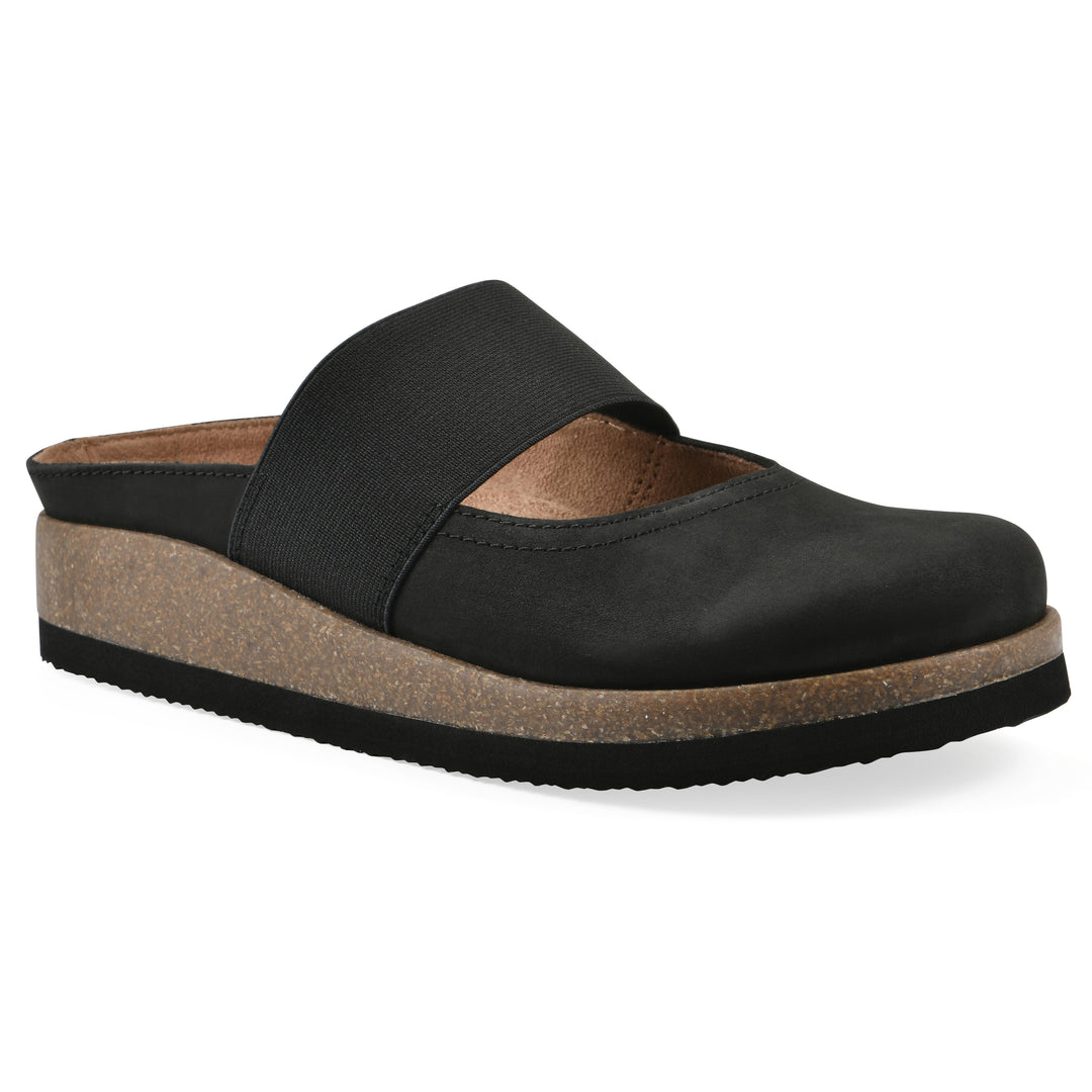 Angle view of a black leather backless clog with Mary Jane style center strap and a brown sole with black bottom