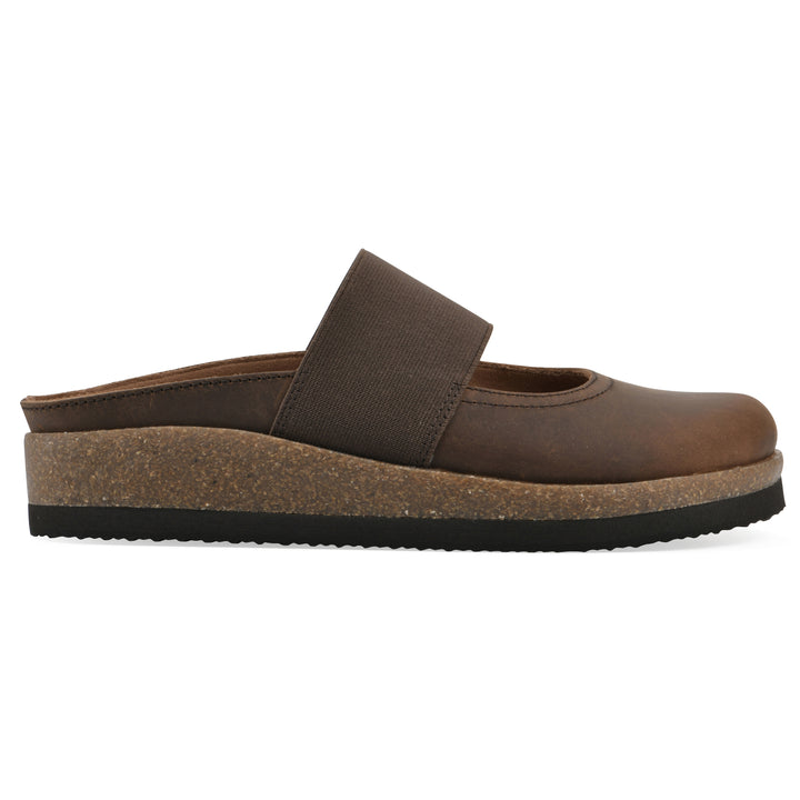 Side view of a brown leather backless clog with Mary Jane style center strap and a brown sole with black bottom