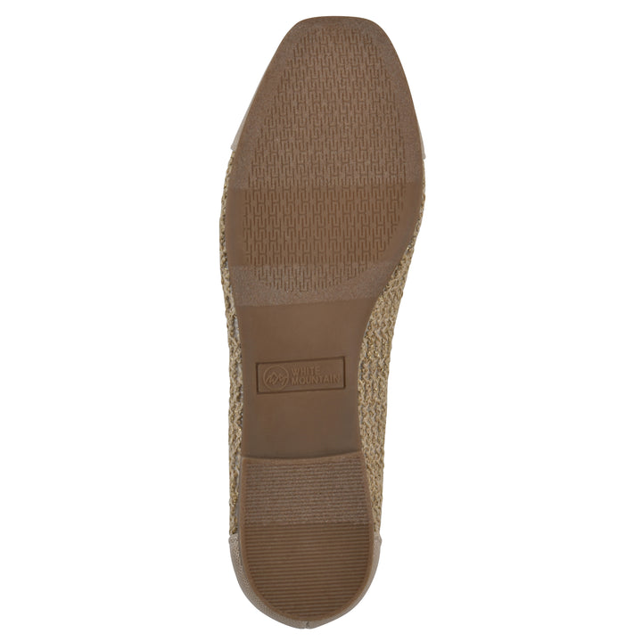 Sole view of a natural metallic raffia flat with small, centered bow and a brown sole