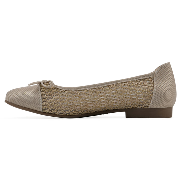 Side view of a natural metallic raffia flat with small, centered bow and a brown sole