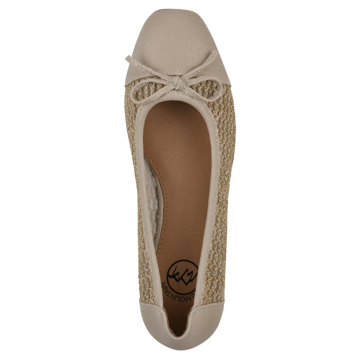 Top view of a natural metallic raffia flat with small, centered bow and a brown sole