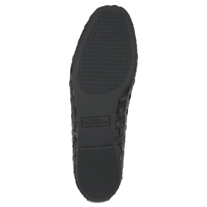 Sole view of a quilted style black flat with low brown sole