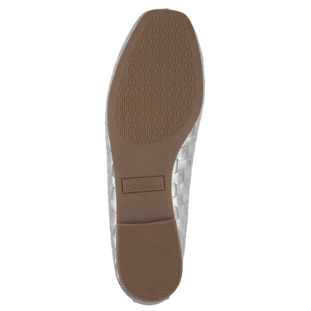 Sole view of a quilted style silver flat with low brown sole