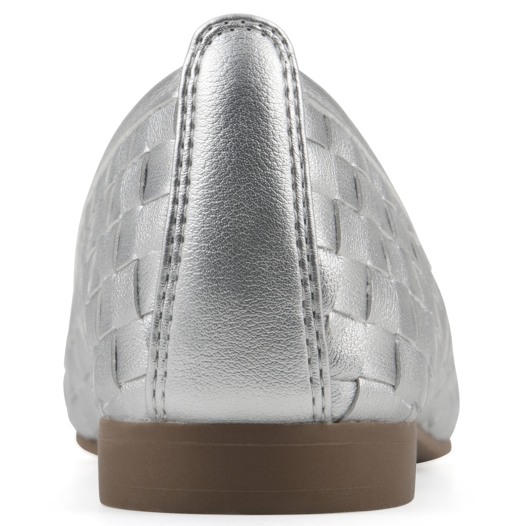 Rear view of a quilted style silver flat with low brown sole