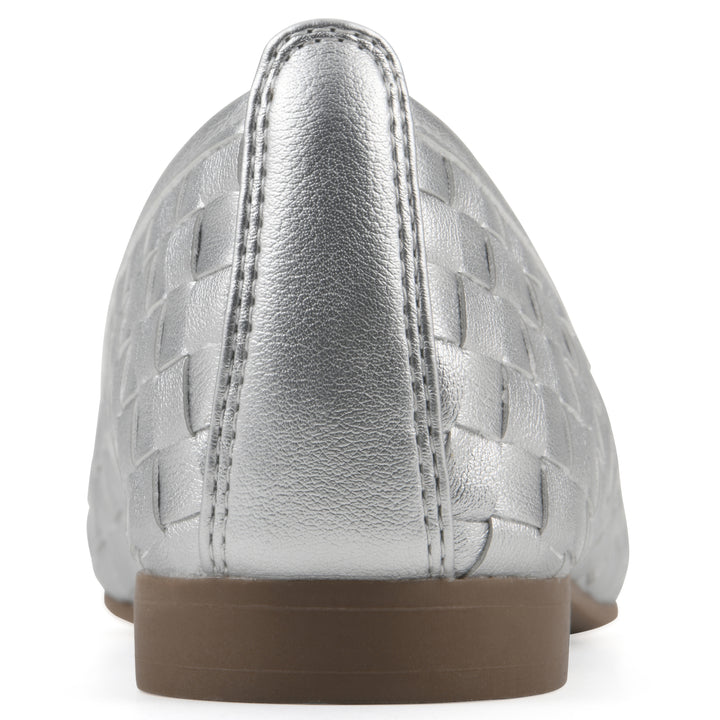 Rear view of a quilted style silver flat with low brown sole
