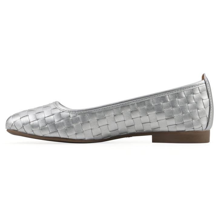 Side view of a quilted style silver flat with low brown sole