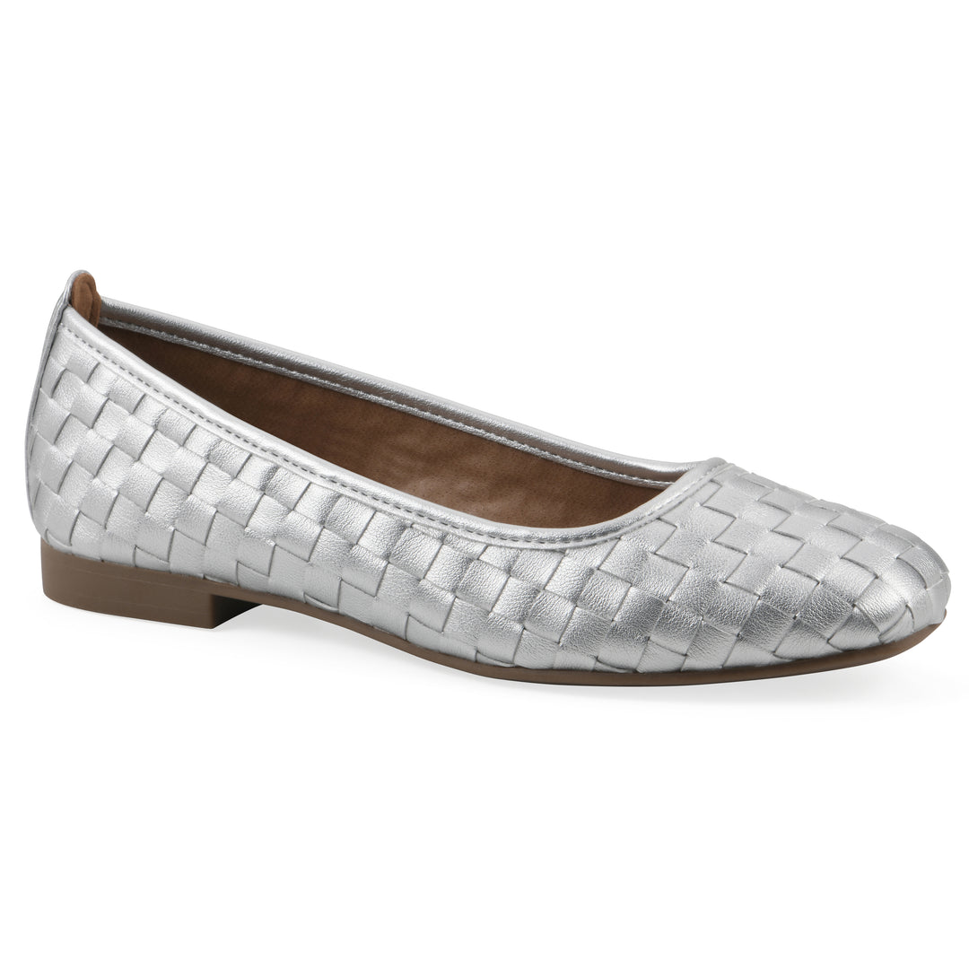 Angle view of a quilted style silver flat with low brown sole
