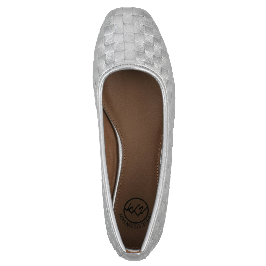 Top view of a quilted style silver flat with low brown sole
