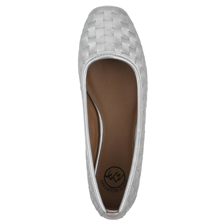 Top view of a quilted style silver flat with low brown sole