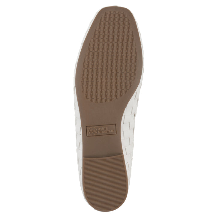 Sole view of a quilted style white flat with low brown sole