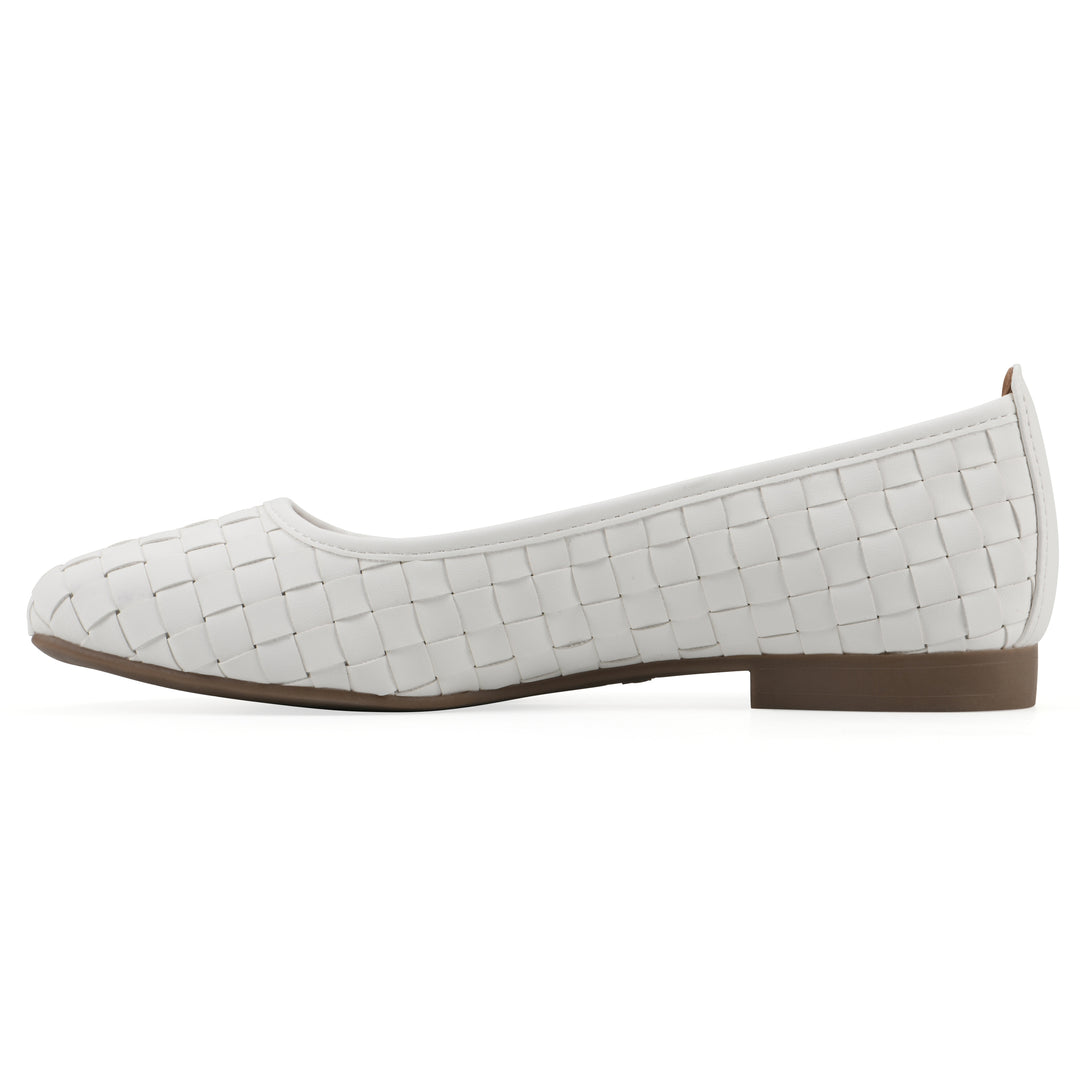 Side view of a quilted style white flat with low brown sole