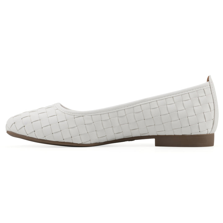 Side view of a quilted style white flat with low brown sole
