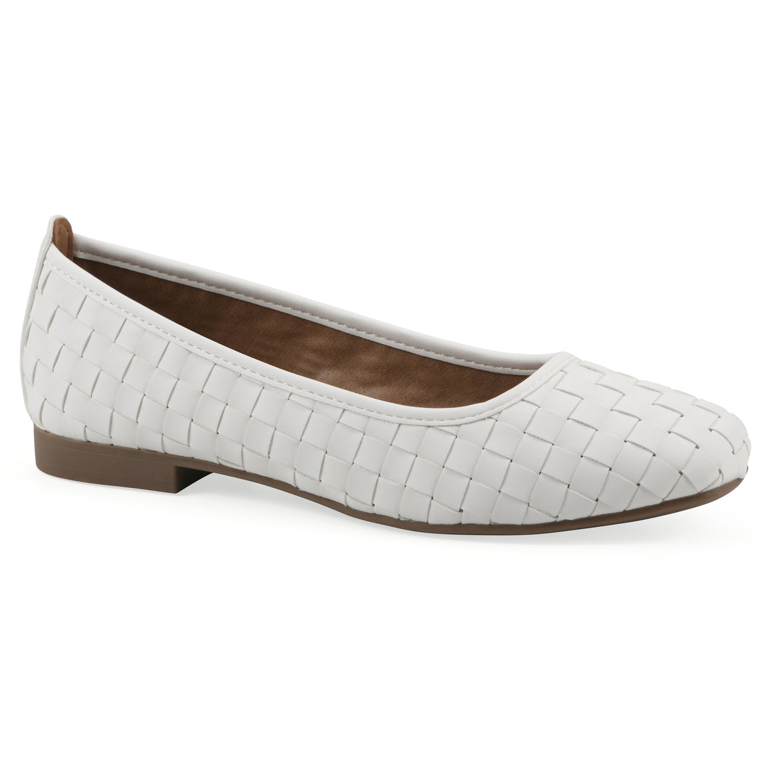 Angle view of a quilted style white flat with low brown sole