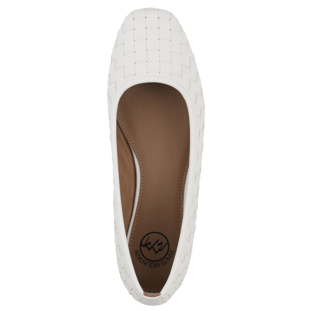 Top view of a quilted style white flat with low brown sole