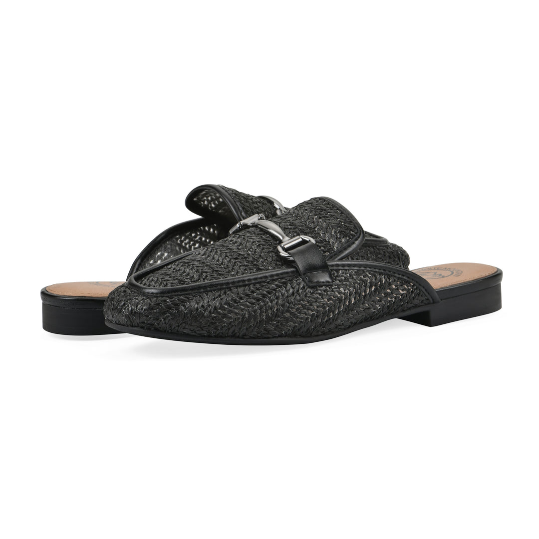 Angle view of a pair of black raffia mules with horizontal metal embellishment and a black 1/2-inch heel