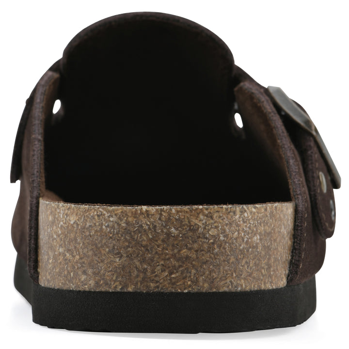 Rear view of a brown suede backless clog with an adjustable buckle strap with stud and eyelet detailing and a black sole