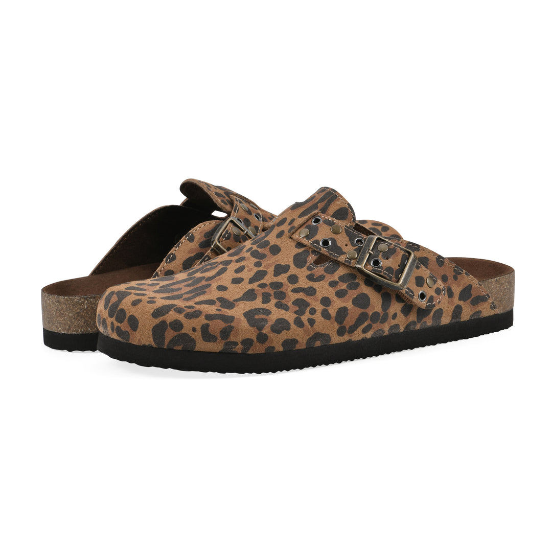 Angle view of a pair of brown leopard suede backless clogs with an adjustable buckle strap with stud and eyelet detailing and a black sole