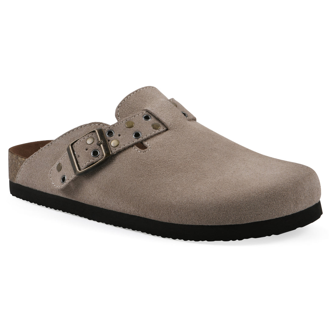 Angle view of a taupe suede backless clog with an adjustable buckle strap with stud and eyelet detailing and a black sole