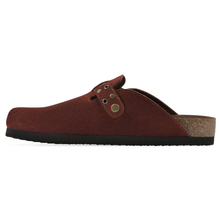 Side view of a rust suede backless clog with an adjustable buckle strap with stud and eyelet detailing and a black sole