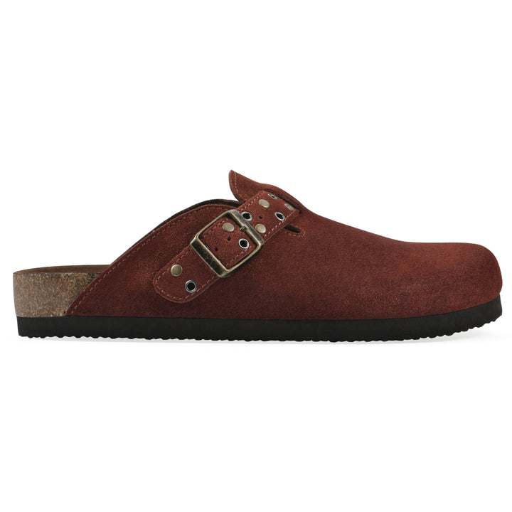 Side view of a rust suede backless clog with an adjustable buckle strap with stud and eyelet detailing and a black sole