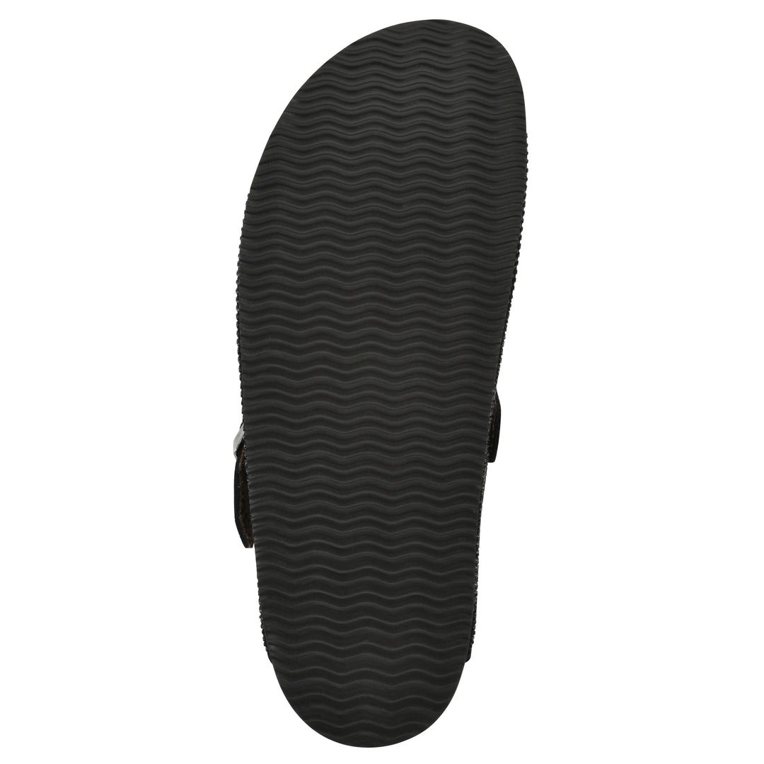 Sole view of a black micro-sequined backless clog with adjustable buckle strap and black sole