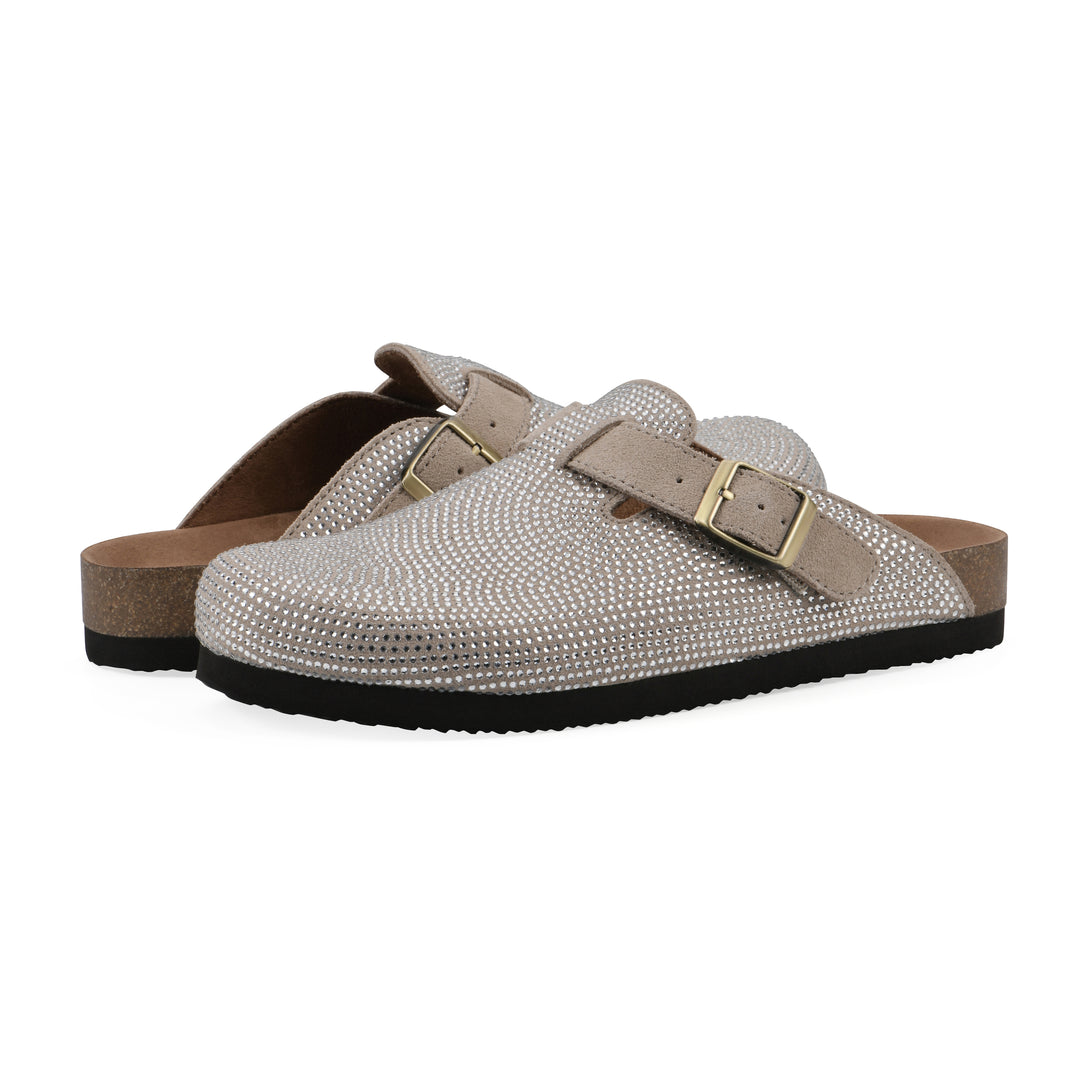 Angle view of a pair of tan micro-sequined backless clogs with adjustable buckle strap and black sole