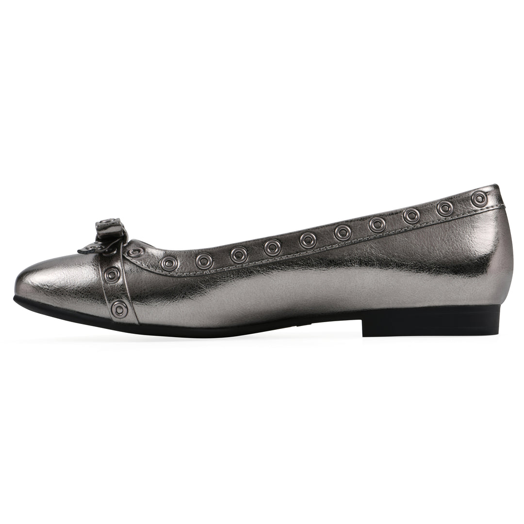 Side view of a pewter metallic flat with small, centered bow, silver metal grommet lining and a black sole