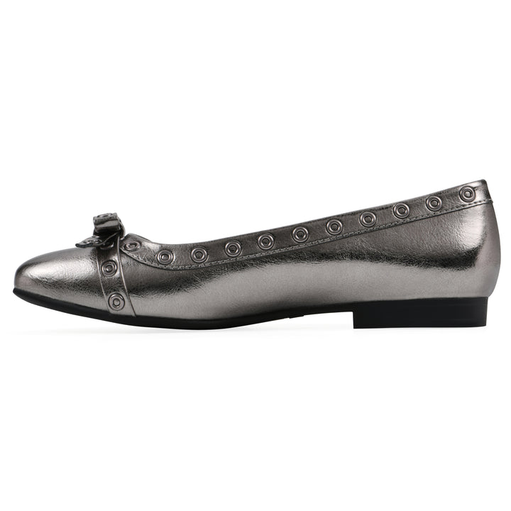 Side view of a pewter metallic flat with small, centered bow, silver metal grommet lining and a black sole