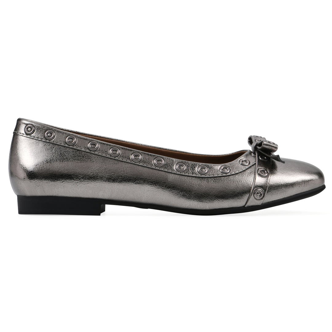 Side view of a pewter metallic flat with small, centered bow, silver metal grommet lining and a black sole