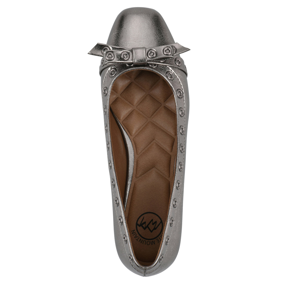 Top view of a pewter metallic flat with small, centered bow, silver metal grommet lining and a black sole