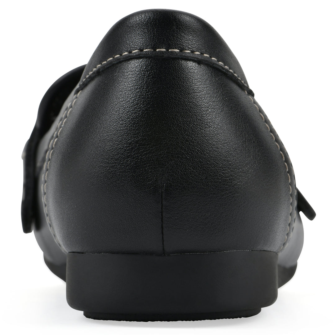 Rear view of a black loafer shoe with gold buckle 