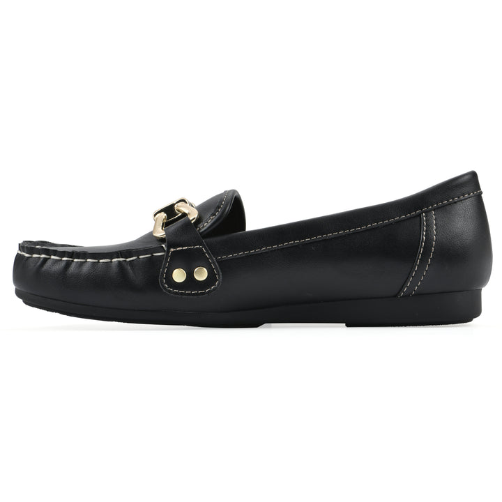 Side view of a black loafer shoe with gold buckle 