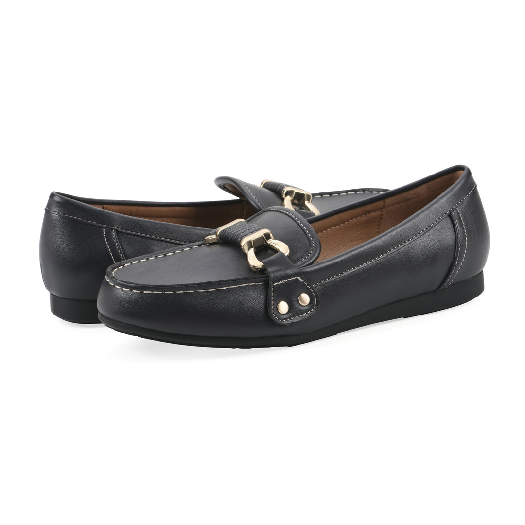 Angle view of a pair of navy loafer shoe with gold buckle 