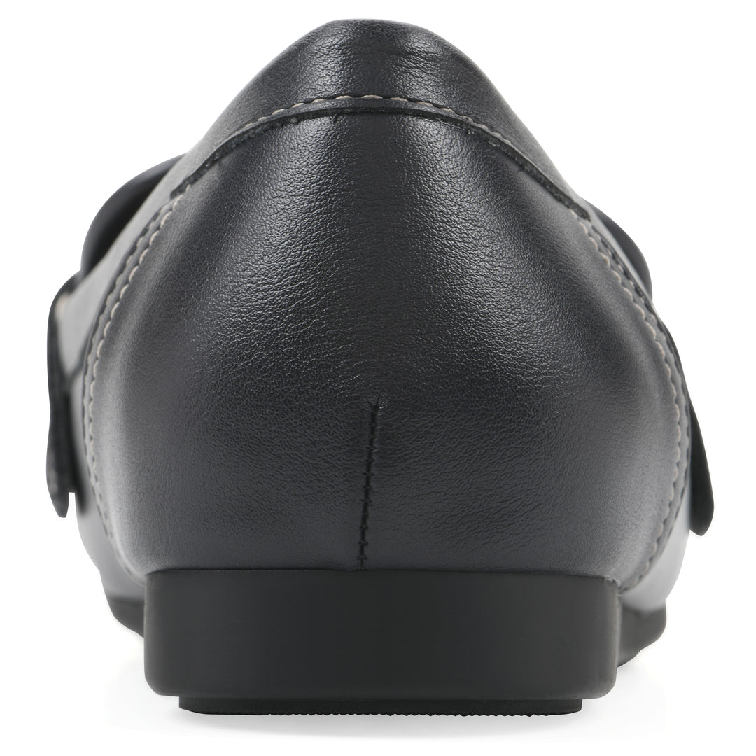 Rear view of a navy loafer shoe with gold buckle 