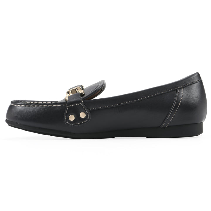 Side view of a navy loafer shoe with gold buckle 