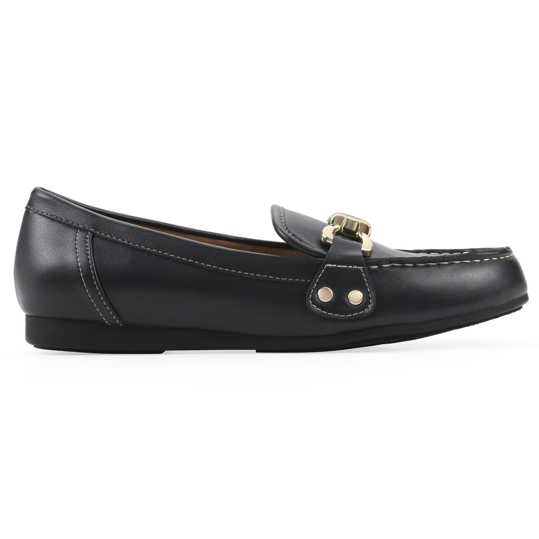 Side view of a navy loafer shoe with gold buckle 