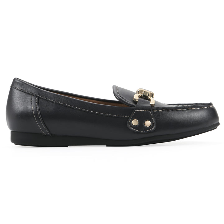 Side view of a navy loafer shoe with gold buckle 
