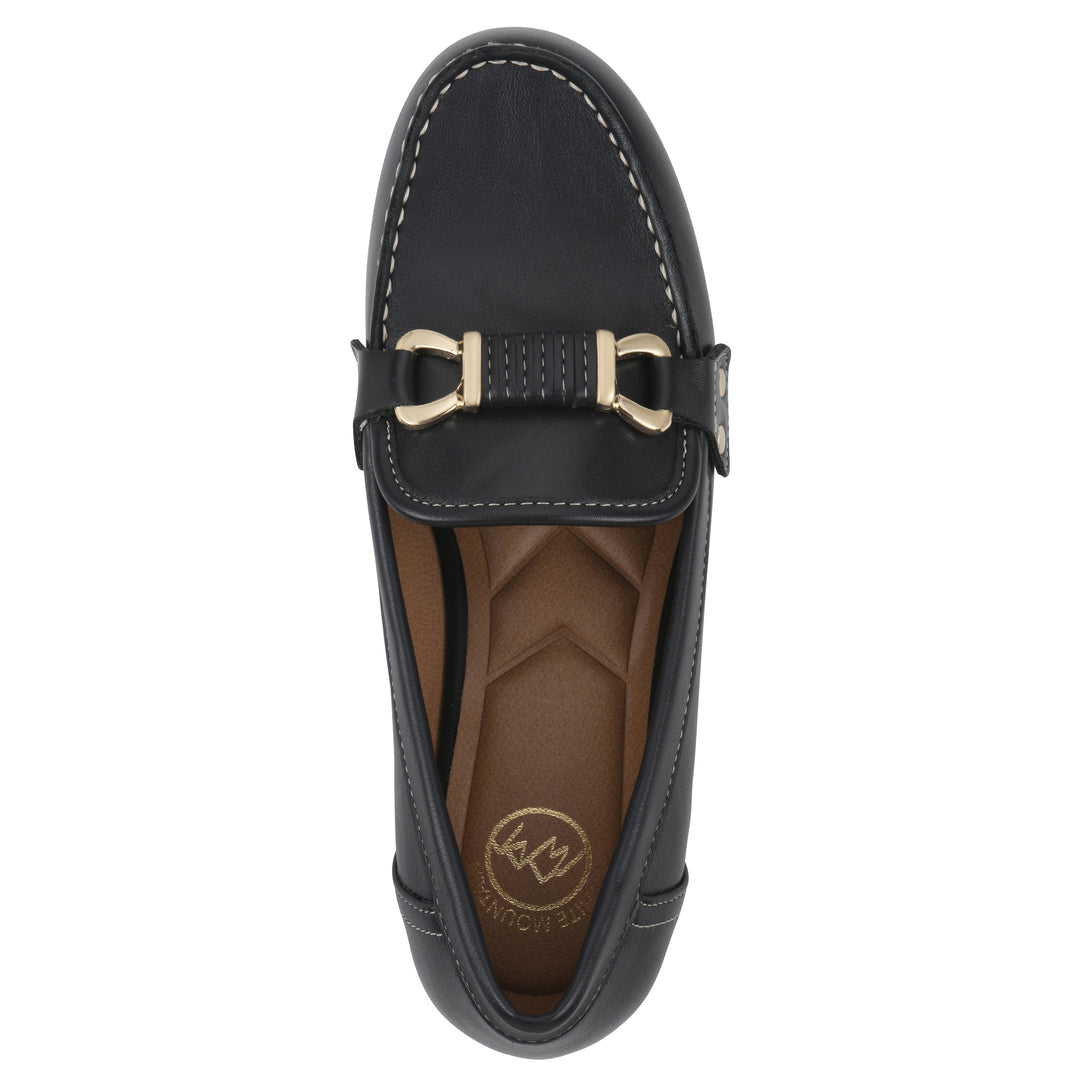 Top view of a navy loafer shoe with gold buckle 