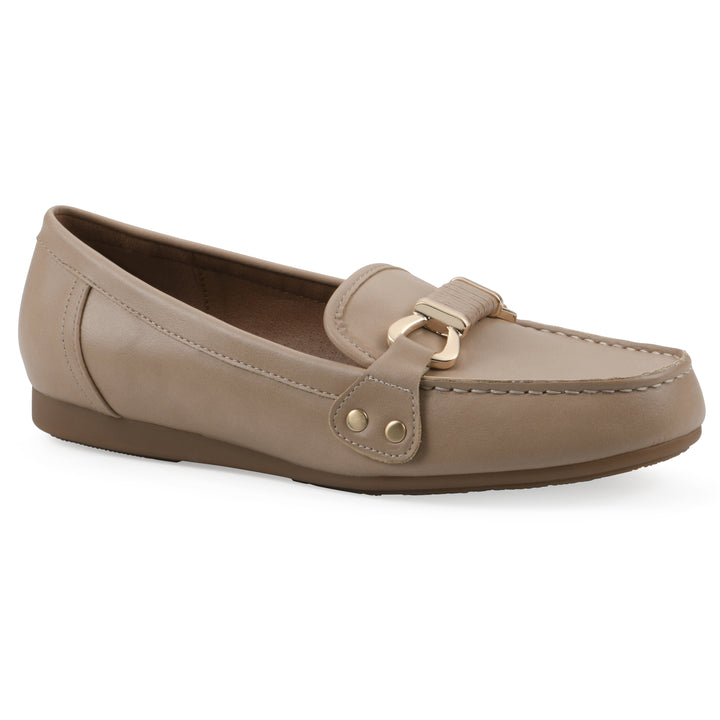 Angle view of a beige loafer with a gold emblem