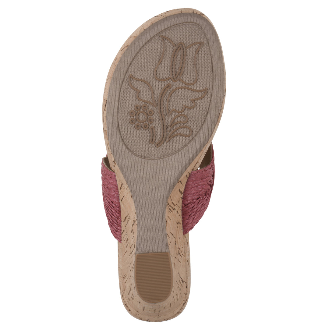 Sole view of a cork print wedge sandal with red raffia thong design