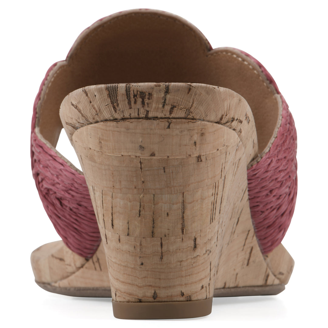 Rear view of a cork print wedge sandal with red raffia thong design