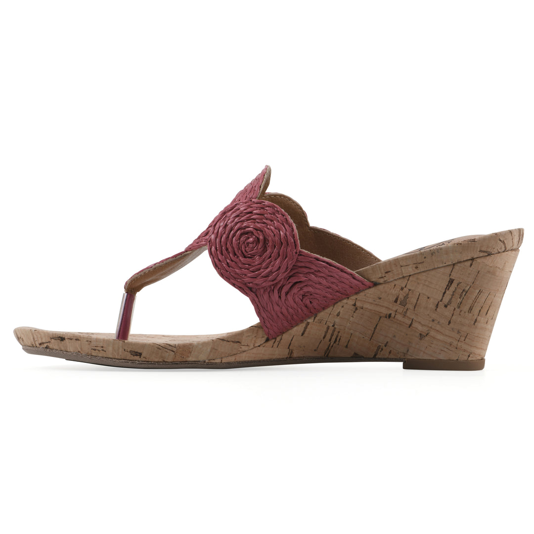 Side view of a cork print wedge sandal with red raffia thong design