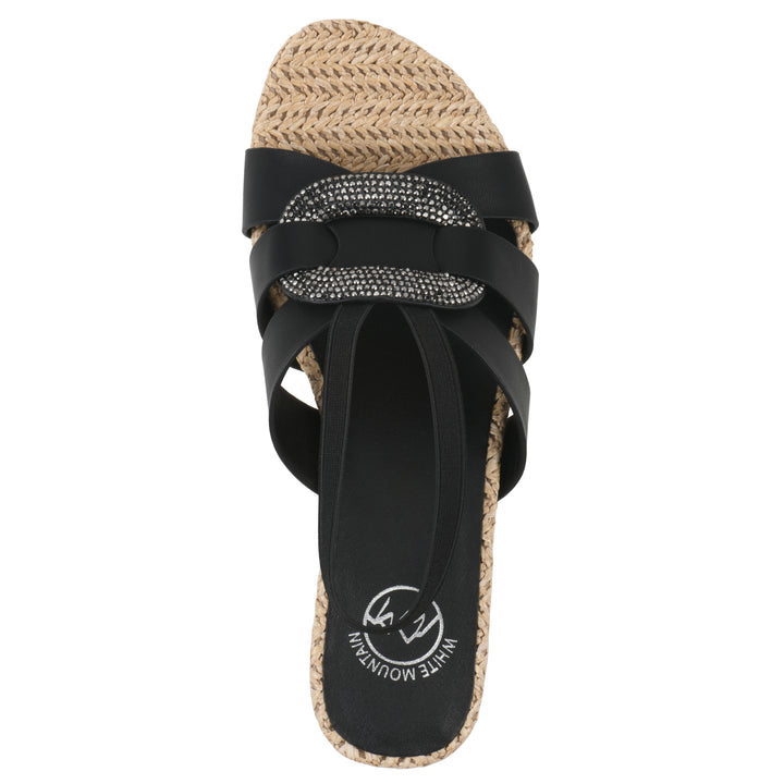 Top view of a black wedge sandal with elastic heel strap, woven raffia sole and a centered, sequin applique