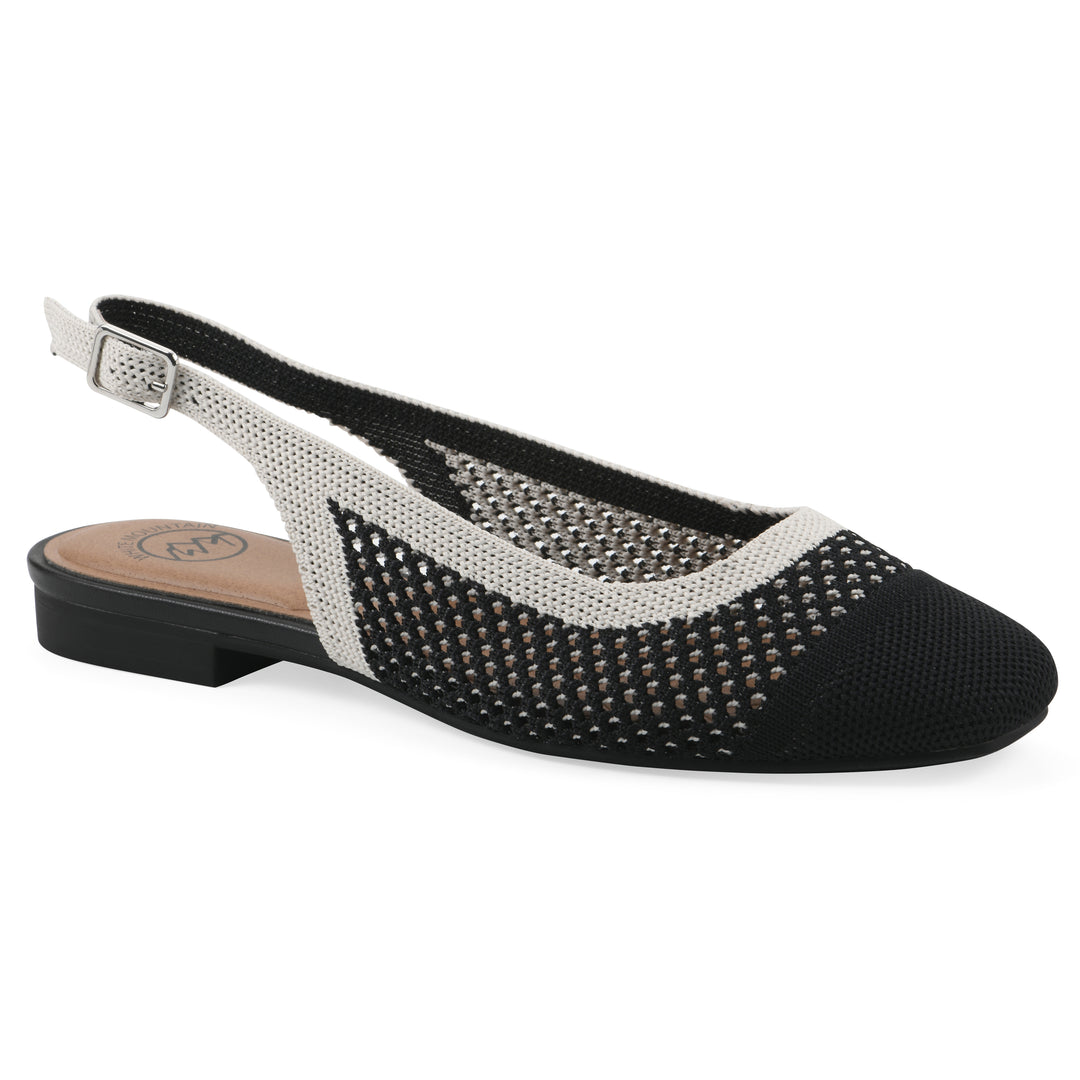 Angle view of a black and white fly-knit slingback with low black heel