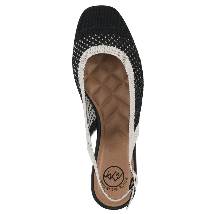 Top view of a black and white fly-knit slingback with low black heel