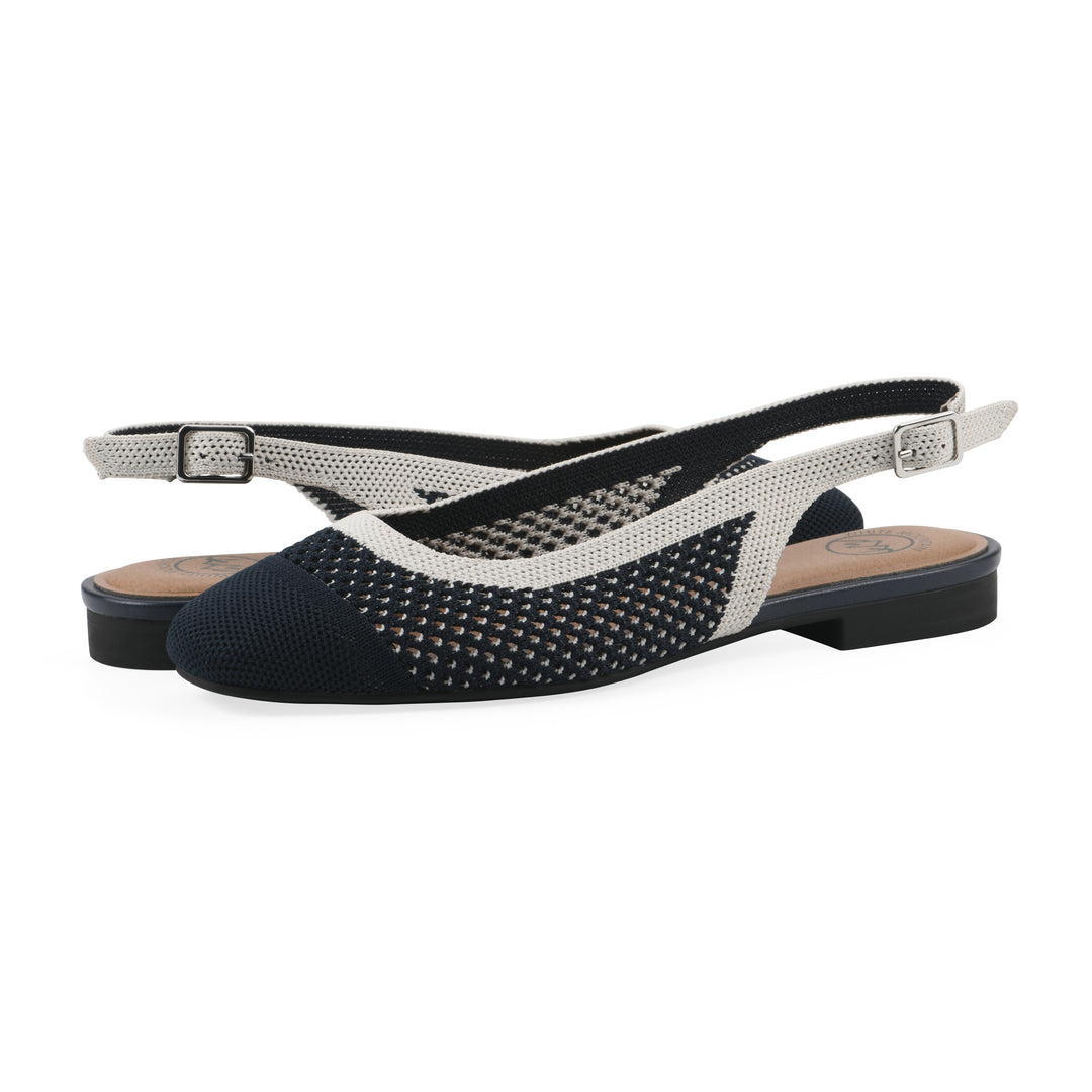Angle view of a pair of white and navy fly-knit slingbacks with low black heel