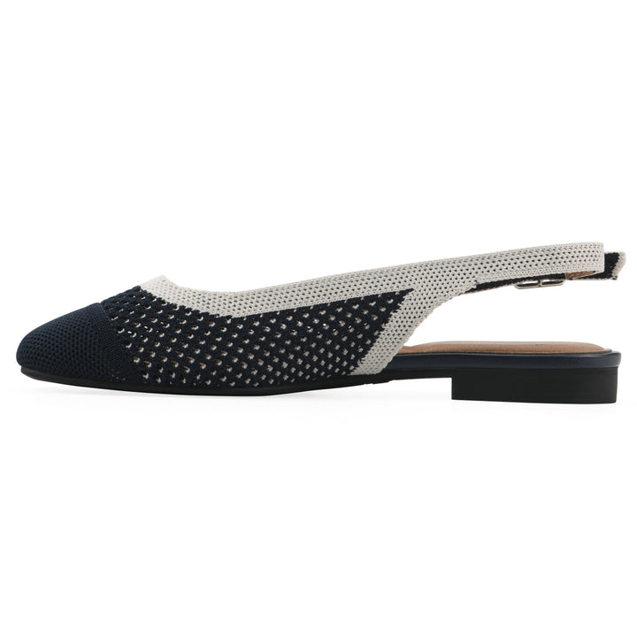 Side view of a white and navy fly-knit slingback with low black heel