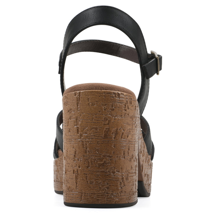 Rear view of a black faux leather platform sandal with buckle style ankle strap and a brown molded cork sole