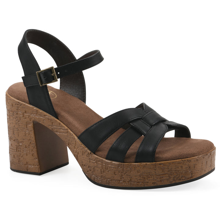 Angle view of a black faux leather platform sandal with buckle style ankle strap and a brown molded cork sole